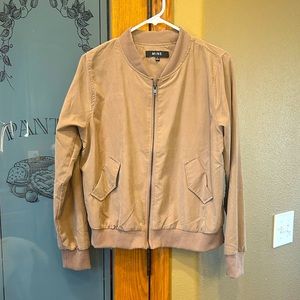 Neutral soft light jacket- fits more like a medium in my opinion.